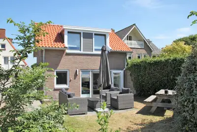 Detached house right on the beach with private garden and private parking.