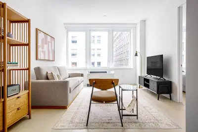 Image de Ideal FiDi 1br w/ Gym, W/D, near Wall Street, by Blueground