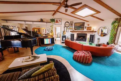 Image de 80s dreamworld with waterfall lagoon, bowling lane, hot tub under the Milky Way