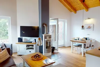 Image de Beautiful, bright 4-person vacation home with fireplace, sauna, garden near the beach