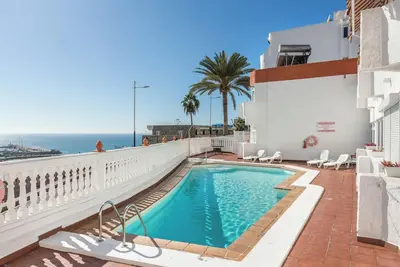 Image de Appartement de vacances 'Sweet Home' avec climatisation, terrasse et piscine partagée