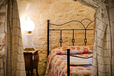 Image de Il Panoramico: trullo house from the 1800s with a view of the vineyard and the Valle d'Itria