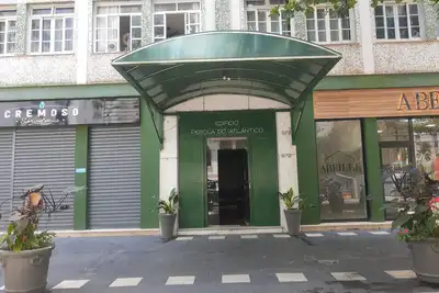 Image de Beautiful studio apartment in the center of Guarujá, 50 meters from the beach, air conditioning, Wi-Fi, partial sea view