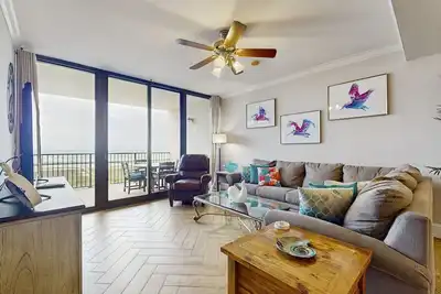 Bright & beachy waterfront condo with pools, tennis, gym, spacious balcony & W/D