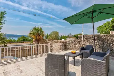 Image de Appartement de vacances avec climatisation et vue sur la mer
