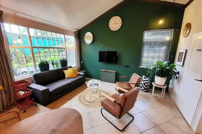 Modern country-style bungalow with hot tub. Pets allowed.