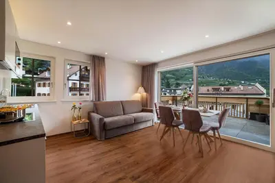 Image de Appartement \"Engel - Kirchturm\" avec vue sur les montagnes, climatisation et sauna