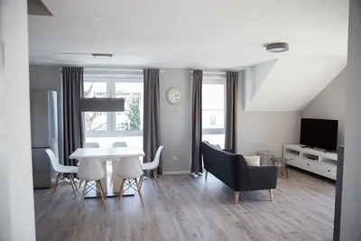 Image de Modern new-build apartment with 35 sqm roof terrace + fireplace
