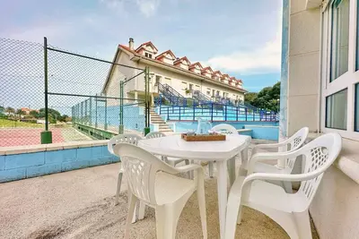 Image de Apartamento con terraza y piscina - La Arena 4203