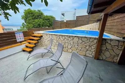 Image de Appartement de vacances avec vue sur la mer et piscine