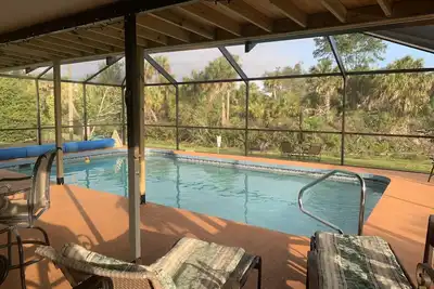 Waterfront single home rental with private lanai, heated pool, and hot tub!