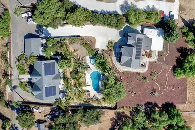 Image de Two Homes, One\n Lot Sleeps 16, Pool & Hot Tub Private Villa, 9 miles from beach.