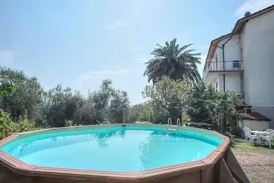 Villa Carol: A graceful apartment that is part of a villa in a quiet position, located on a hillside above the sea, with Free Wi-Fi.