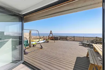 Image de Exclusive Beachfront Home with Panoramic Views & Family Fun.