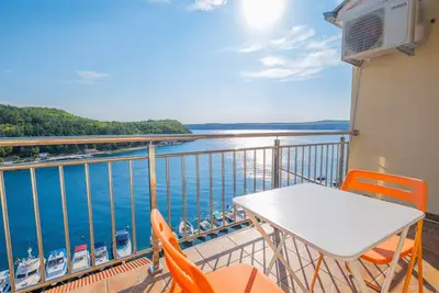 Image de Appartement de vacances avec air conditionné et vue sur la mer