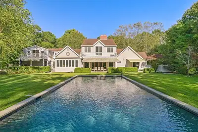 Image de Traditional-style home with a private pool, open-floor living areas, four. . .