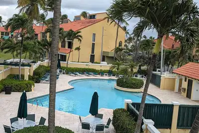2br/2ba Villa beach front, golf w/ WiFi, large balcony, steps from the sand!