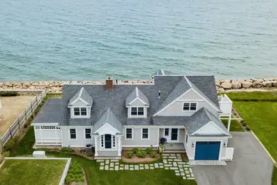 Image de Coastal chic meets French Provençal in this newly renovated oceanfront home.