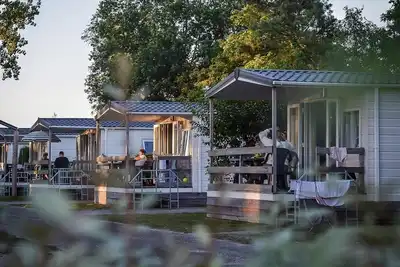 Image de A cozy cottage with porch for the whole family. Celebrate vacations!