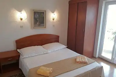 Image de Appartement de vacances Stanići pour 1 - 5 personnes avec 2 chambres à coucher - Maison jumelée