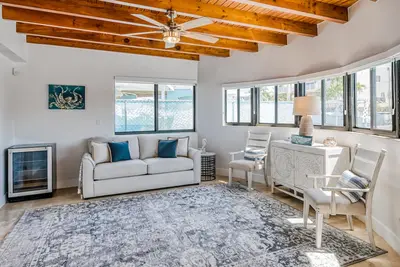 Image de Waterfront home with private dock, canal views, large terrace & modern kitchen