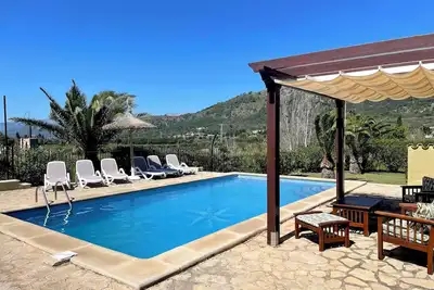 Image de Villa Can Corro avec vue sur les montagnes, Wi-Fi, climatisation, piscine, jardin et terrasse