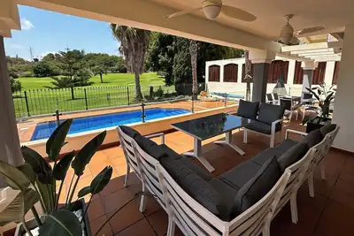 Image de Unwind at this front-line private luxury villa with panoramic golf and sea views
