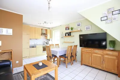 Image de Ferienhaus am Deich Wohnung 08
