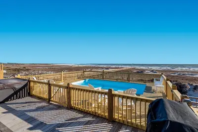 Experience luxury at Blue Pearl, a stunning 5-bedroom beachfront home in Dauphin Island