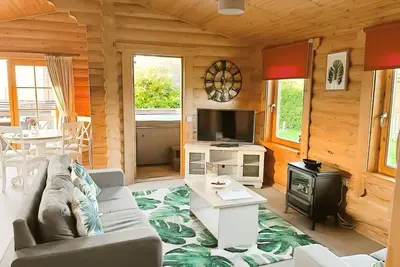 Image de A luxury log cabin that sleeps 4 guests  in 2 bedrooms