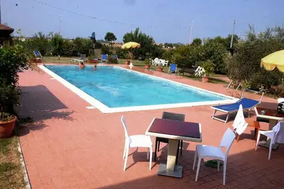 Image de Trilocale con Accesso Piscina