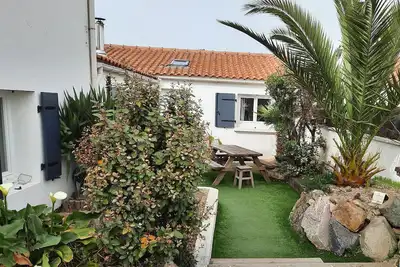 Image de Maison avec patio à 5 min de la plage