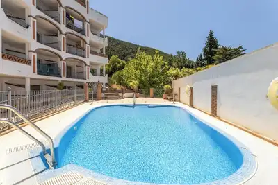 Appartement Ático Alcaucín avec vue sur la montagne, piscine, W-Fi, jardin et terrasse