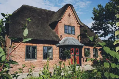 Image de 5* thatched roof house Ziegelmacher - Vörn 6600sqm natural garden with pond and outdoor sauna