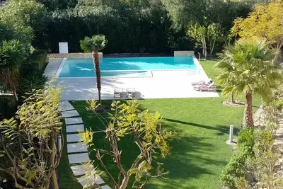 Image de Cosy apartment with marina, pool and garden views.