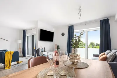 Image de Meerzeit - shower room, covered balcony, garden furniture, Tv, washing machine