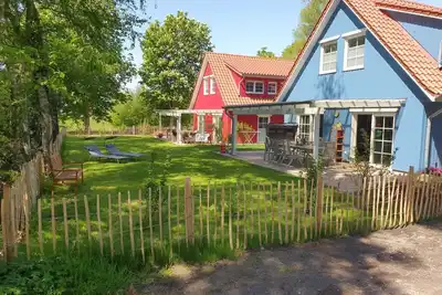 Image de ~ Color magic blue in Conneforde ~ with large terrace, garden, sauna d