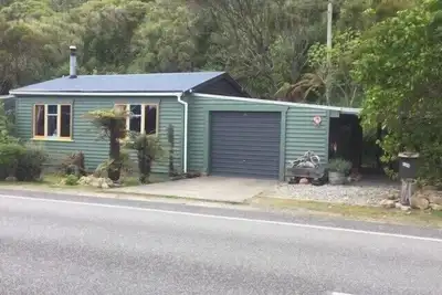 Nestled in the beautiful New Zealand bush a classic Kiwi bach.