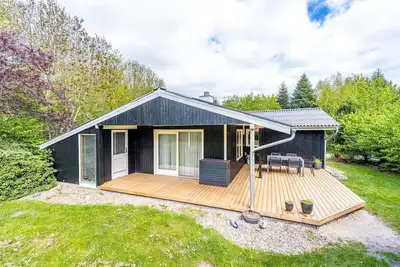 Image de Maison de vacances pour 4 a Oksbøl-By Traum