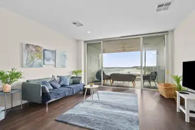 Image de Meander ~ Port Noarlunga South - Perched up high on the red sandstone beach cliffs, your vantage point offers unrivalled views of where the Onkaparinga River meets the sea – just outside your front door.