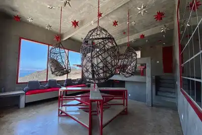 Eclectic Cliffside Den with Hanging Living Area