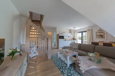 Image de New, bright and friendly beach vacation apartment for up to 6 people with sauna house.