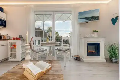 Image de Vacation apartment right by the sea with sauna and fireplace.