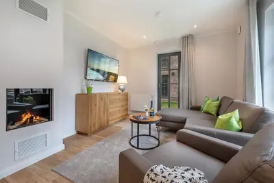Image de Central newly built vacation apartment with gas fireplace near the beach for 4 pers.
