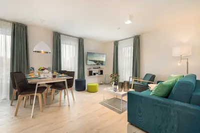 Your accommodation is bright, spacious and right in the center, with sauna and fireplace in the house.
