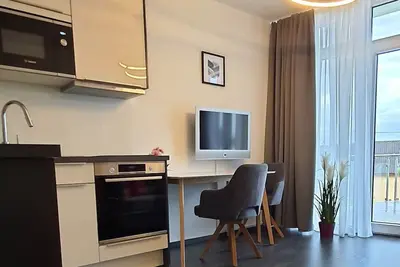 Image de Apartment with lake view and terrace, 1 living\/bedroom, max. 2 persons