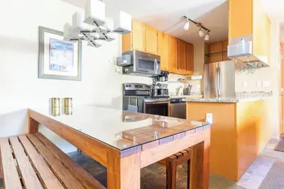 Image de Located near the Village and can sleep a crowd! Year round hot tub near condo
