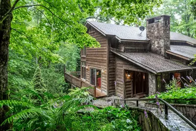 Image de Secluded escape with wraparound deck, gazebo, lofted layout, & wooded acreage
