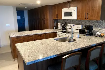 Image de Beachfront, ground level condo, steps away from beach, pool and relaxation!