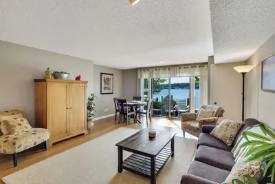 Image de Stunning Lake Charlevoix Views with Walkout Patio | Pool, Hot Tub, Sauna